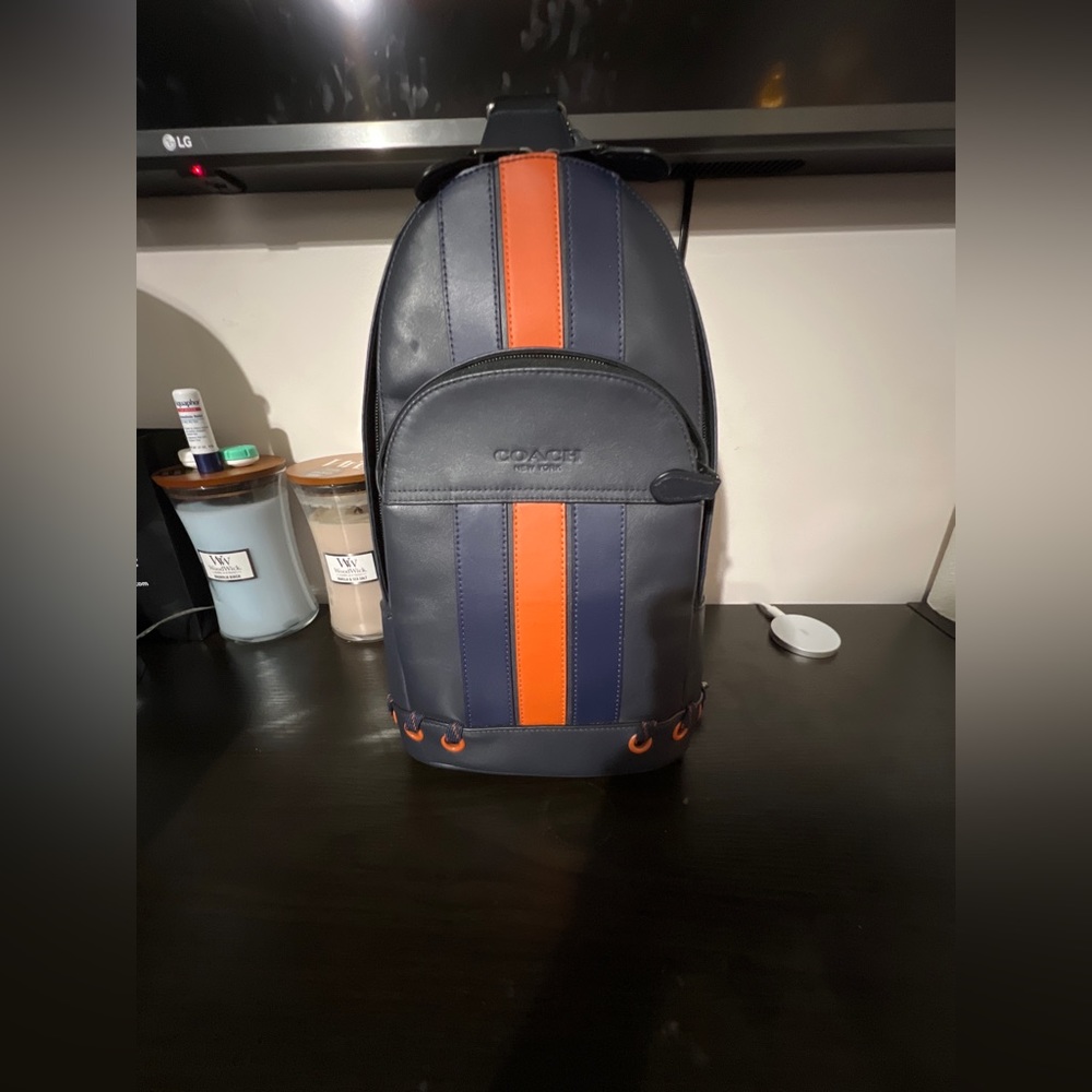 Coach west pack with varsity stripe